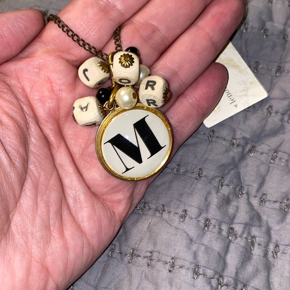 Lenora Dame wooden letter necklace.